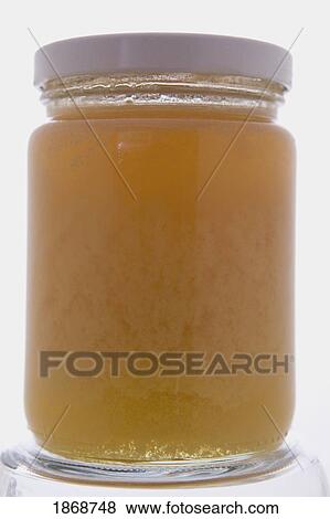 Stock Photo - glass jar of honey. Fotosearch