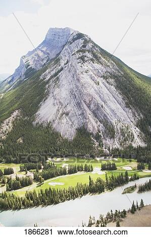 Stock Image - Golf course with Mount Rundle and Bow River, Banff National Park, Alberta, Canada. Fotosearch