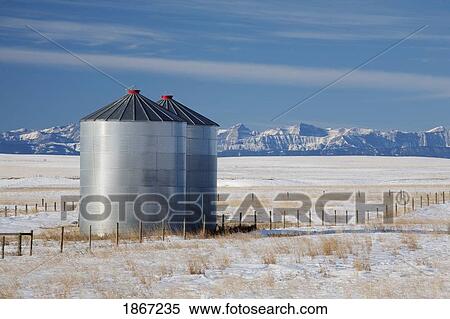 Grain silos in a winter field View Large Photo Image Stock Photography - Grain silos in a winter field. Fotosearch