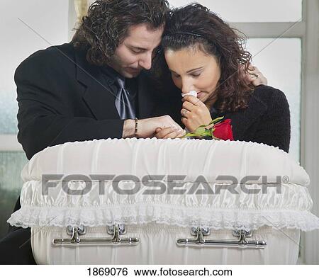 grieving couple with infant's coffin View Large Photo Image Stock Photograph - grieving couple with infant's coffin. Fotosearch