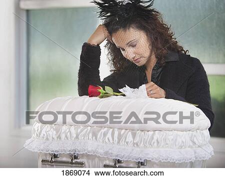 grieving mother with an infant's coffin View Large Photo Image Picture - grieving mother with an infant's coffin. Fotosearch