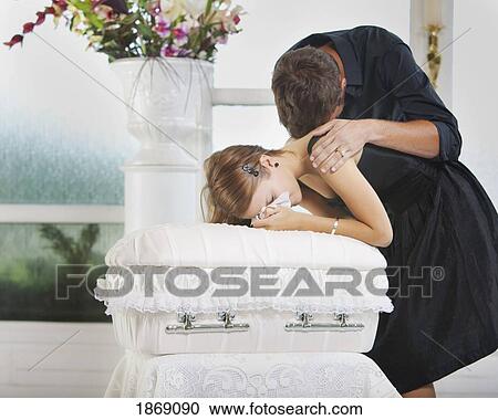 grieving young couple with an infant's coffin View Large Photo Image Stock Image - grieving young couple with an infant's coffin. Fotosearch