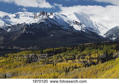 Stock Image - gunnison national forest, colorado, united states of america; the mountains and autumn colors on the aspen trees (populus tremuloides). Fotosearch