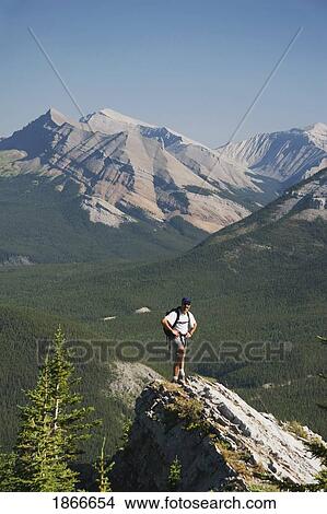 Picture - Hiker on a mountain. Fotosearch