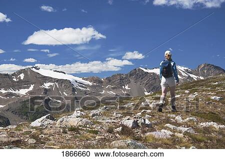Hiker on mountain View Large Photo Image Stock Image - Hiker on mountain. Fotosearch