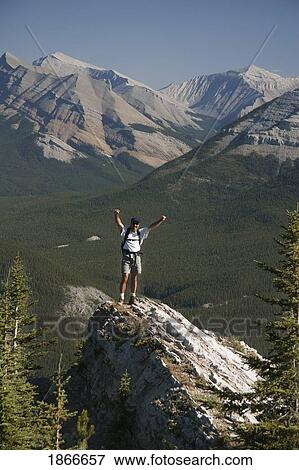 Stock Photo - Hiker on mountain. Fotosearch