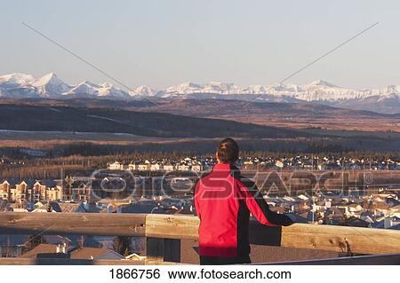 Man looking out over Calgary, Alberta, Canada View Large Photo Image Stock Photograph - Man looking out over Calgary, Alberta, Canada. Fotosearch