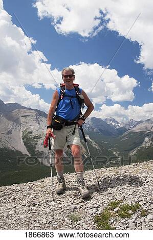 Man on a mountain trail View Large Photo Image Stock Image - Man on a mountain trail. Fotosearch