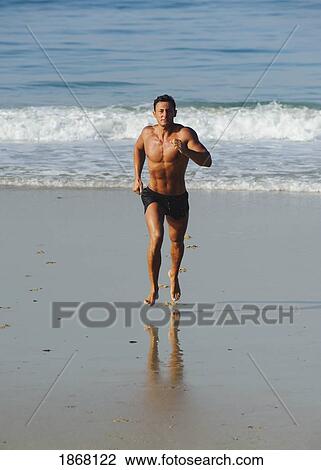 man running on the beach View Large Photo Image Stock Image - man running on the beach. Fotosearch