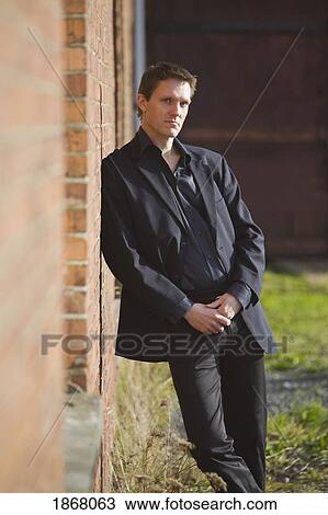 man wearing a suit View Large Photo Image Stock Image - man wearing a suit. Fotosearch