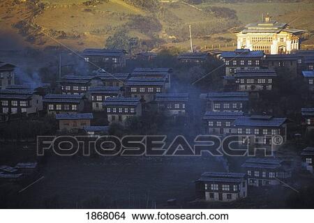 Picture - monastery and village of ura at sunrise, ura, bhutan. Fotosearch