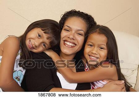 Stock Photo - mother and her daughters. Fotosearch