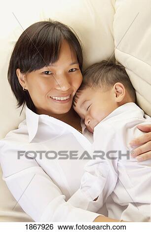 mother holding her son View Large Photo Image Stock Photograph - mother holding her son. Fotosearch