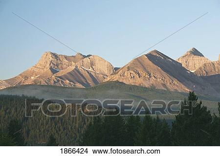 Picture - Mountain range at sunrise, Crowsnest, Alberta, Canada. Fotosearch