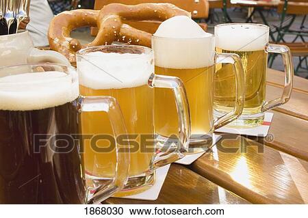 mugs of beer and a pretzel View Large Photo Image Stock Image - mugs of beer and a pretzel. Fotosearch