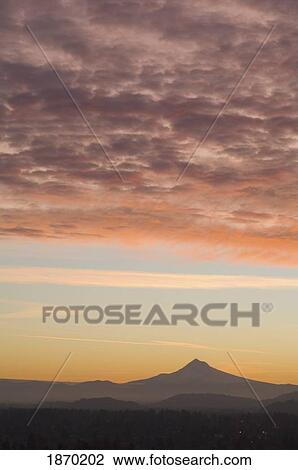 Stock Image - portland, oregon, united states of america; view of the sunrise over mount hood from mount tabor. Fotosearch