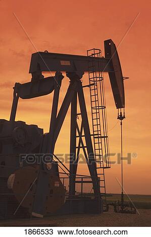 Pump jack at sunset View Large Photo Image Stock Image - Pump jack at sunset. Fotosearch