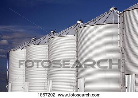 Row of metal silos View Large Photo Image Stock Image - Row of metal silos. Fotosearch