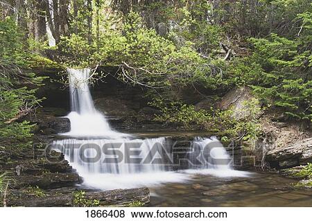 Small waterfall, Waterton Lakes National Park, Alberta, Canada View Large Photo Image Stock Photo - Small waterfall, Waterton Lakes National Park, Alberta, Canada. Fotosearch