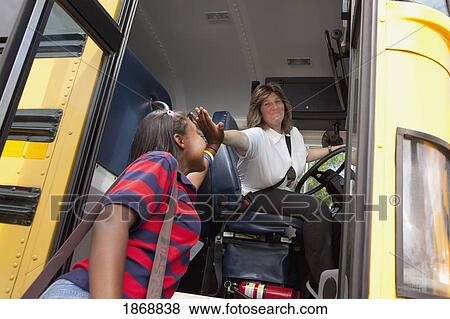 Stock Photo - student and school bus driver slapping hands in a 'high five'. Fotosearch