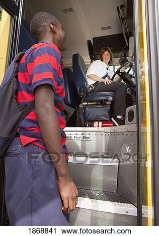 Stock Image - student greeting the school bus driver. Fotosearch