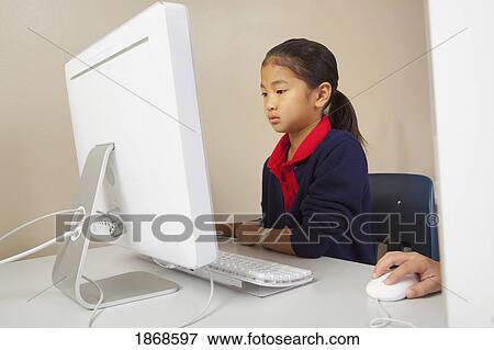 Stock Photo - student working on a computer. Fotosearch