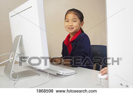 Stock Photo - student working on a computer. Fotosearch