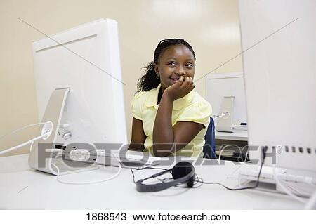 Stock Image - student working on the computer. Fotosearch
