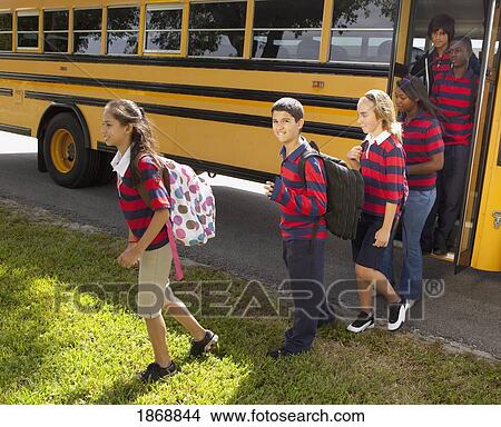 Picture - students getting off the school bus. Fotosearch