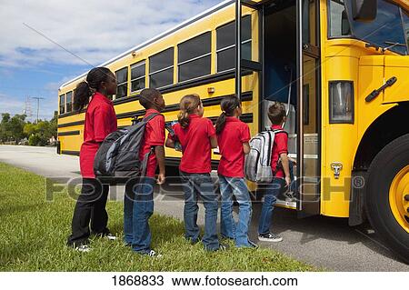 students lined up to get on the school bus View Large Photo Image Stock Image - students lined up to get on the school bus. Fotosearch