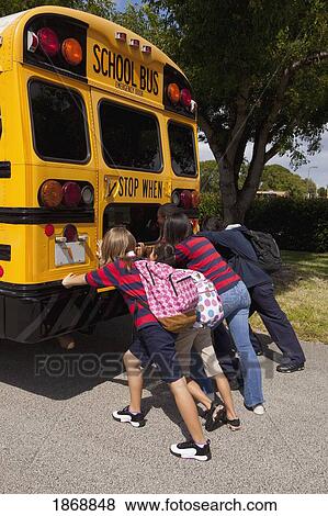 students pushing the back of the school bus View Large Photo Image Stock Photo - students pushing the back of the school bus. Fotosearch