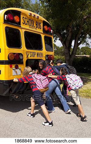 students pushing the back of the school bus View Large Photo Image Stock Photo - students pushing the back of the school bus. Fotosearch