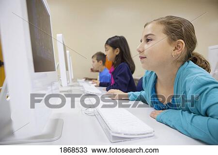 Stock Image - students working on computers. Fotosearch