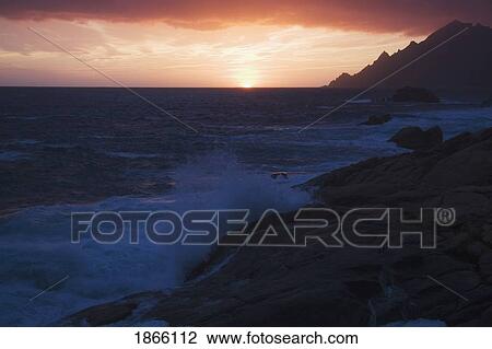 Sunset along rocky coast, Porto, Corsica, France View Large Photo Image Stock Image - Sunset along rocky coast, Porto, Corsica, France. Fotosearch