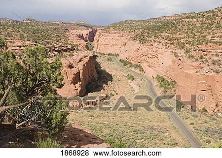 utah, united states of america; road entering a narrow canyon at grand staircase-escalante national monument View Large Photo Image Stock Photo - utah, united states of america; road entering a narrow canyon at grand staircase-escalante national monument. Fotosearch