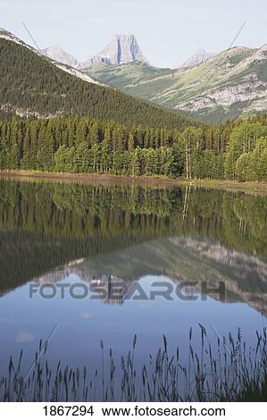 Picture - wedge pond with fortress mountain in the distance, kananskis country, alberta, canada. Fotosearch