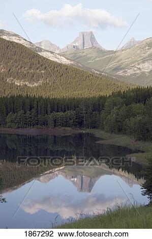 wedge pond with fortress mountain in the distance, kananskis country, alberta, canada View Large Photo Image Stock Image - wedge pond with fortress mountain in the distance, kananskis country, alberta, canada. Fotosearch