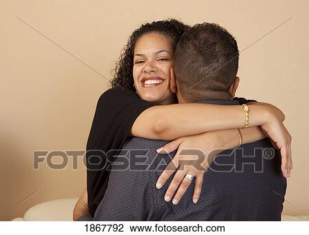 wife hugging her husband View Large Photo Image Stock Image - wife hugging her husband. Fotosearch