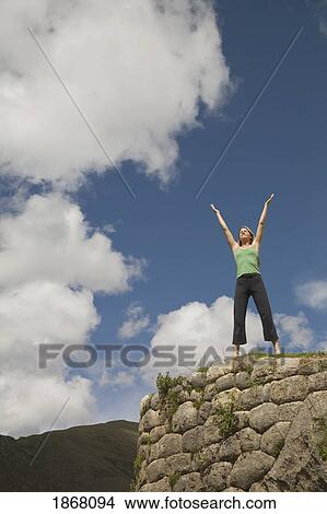 Picture - woman doing yoga, cuzco (cusco), peru. Fotosearch