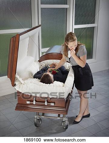 woman grieving at husband's coffin View Large Photo Image Stock Image - woman grieving at husband's coffin. Fotosearch