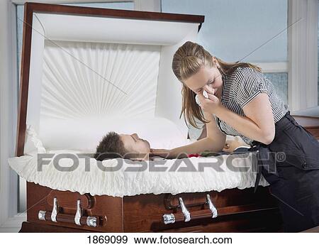 woman grieving at husband's coffin View Large Photo Image Stock Photo - woman grieving at husband's coffin. Fotosearch