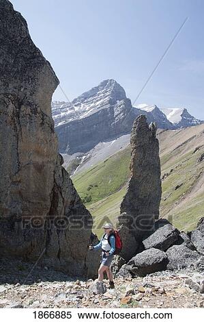 Stock Photography - Woman hiking in the mountains. Fotosearch