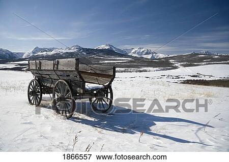 Stock Photo - Wooden wagon in the snow. Fotosearch