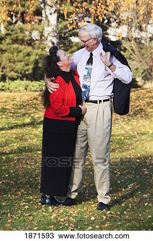 a couple in an embrace in the park in autumn View Large Photo Image Stock Image - a couple in an embrace in the park in autumn. Fotosearch