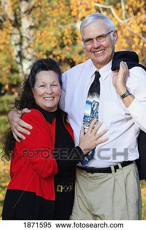 a couple in the park in autumn View Large Photo Image Stock Photography - a couple in the park in autumn. Fotosearch