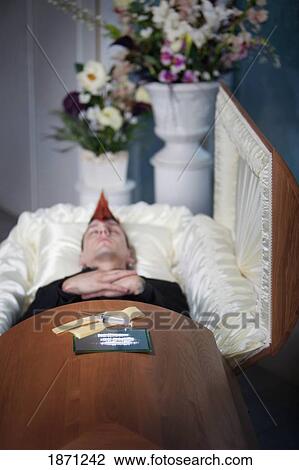 a deceased young man in a coffin with syringes laying on top View Large Photo Image Stock Image - a deceased young man in a coffin with syringes laying on top. Fotosearch