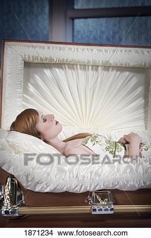 a deceased young woman in a coffin View Large Photo Image Picture - a deceased young woman in a coffin. Fotosearch