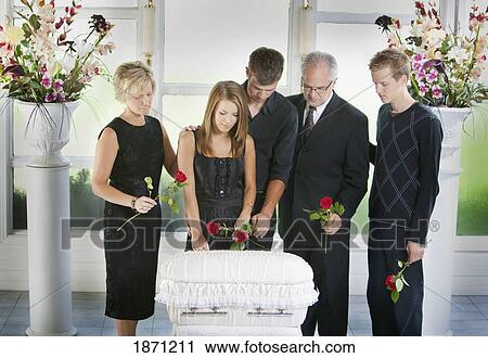 a family gathered around an infant's coffin View Large Photo Image Stock Image - a family gathered around an infant's coffin. Fotosearch