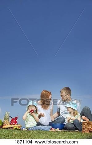 a family having a picnic View Large Photo Image Picture - a family having a picnic. Fotosearch