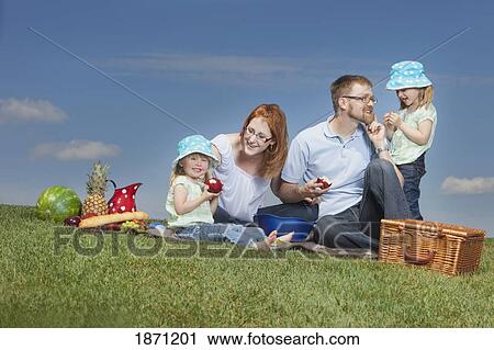 a family having a picnic View Large Photo Image Stock Image - a family having a picnic. Fotosearch